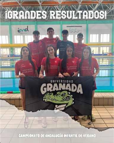 University of Granada age-group swimmers with the club banner by the pool