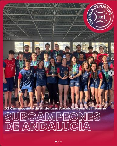 University of Granada swimming team with medals at the pool in Málaga